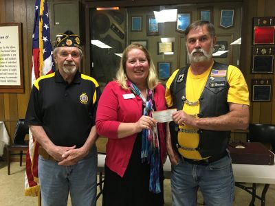 Cancer navigators receiving check from Legion Riders